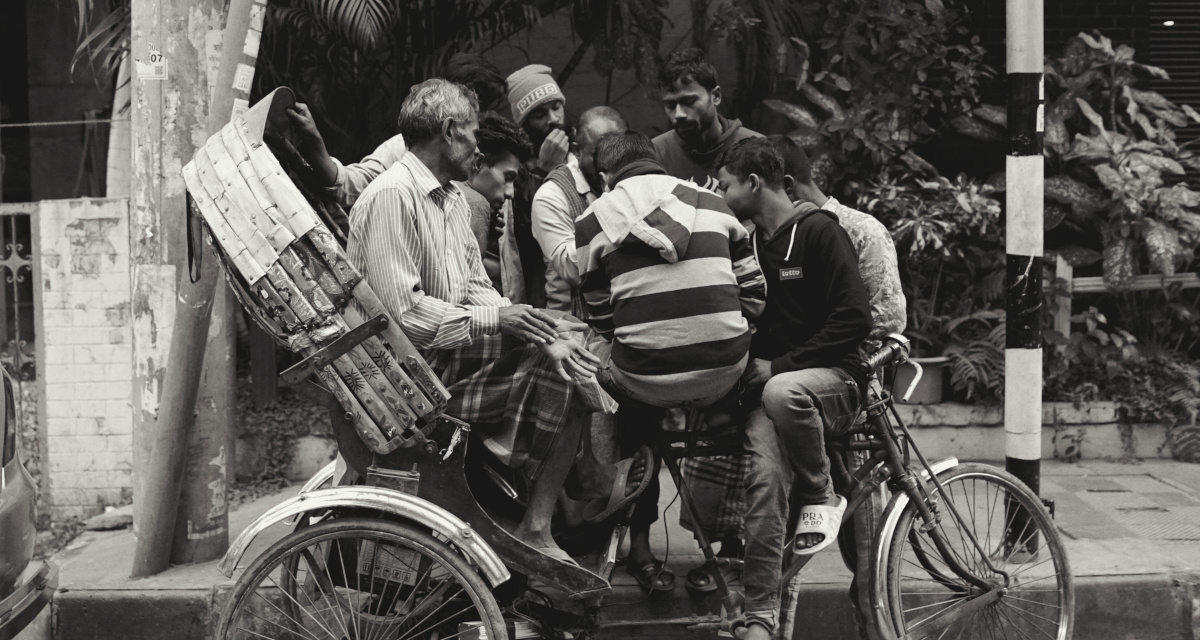 a few rickshaw-wallas, enjoying their free time, playing ludo!